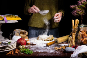 a person making a dough for Polish pierogi